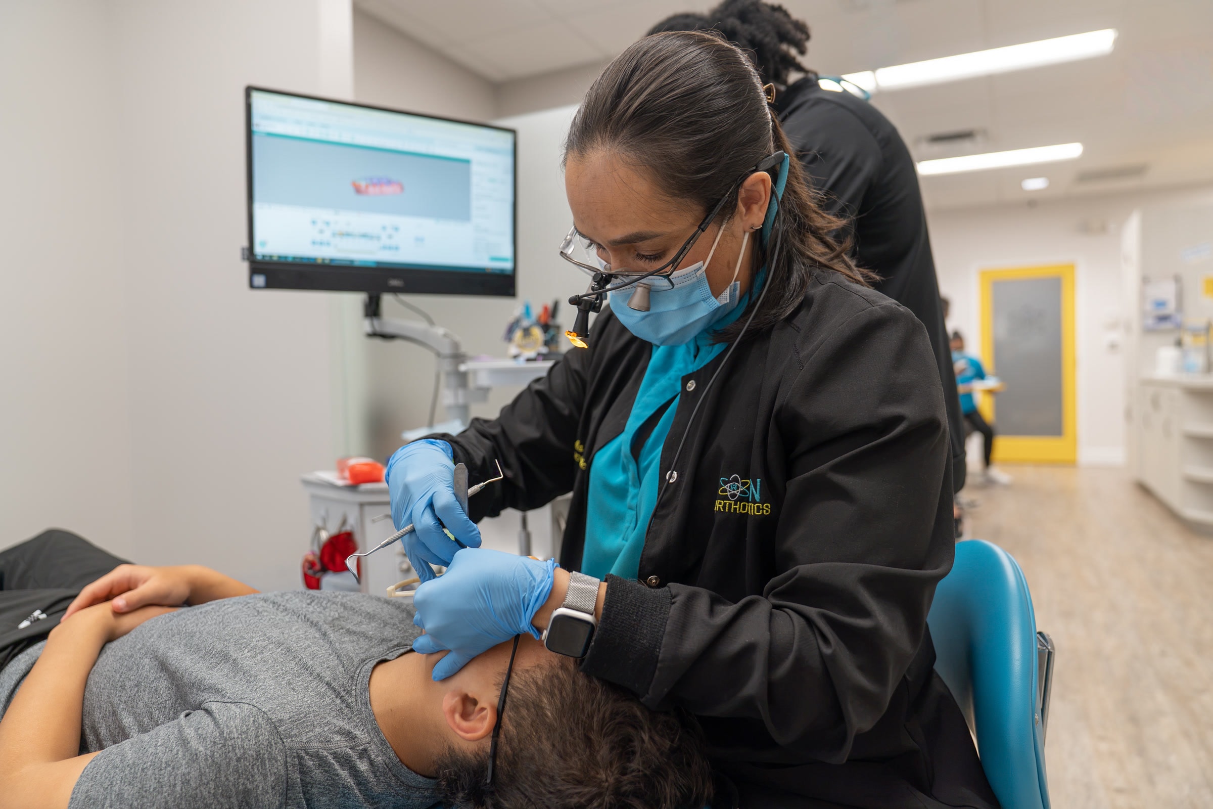 A braces adjustment during an orthodontic visit at ION Orthodontics in Port St. Lucie